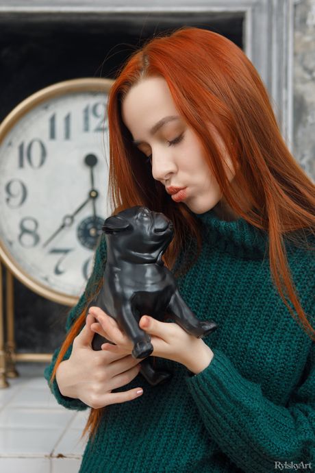 Sexy redhead Sherice takes off everything on a bed with grace