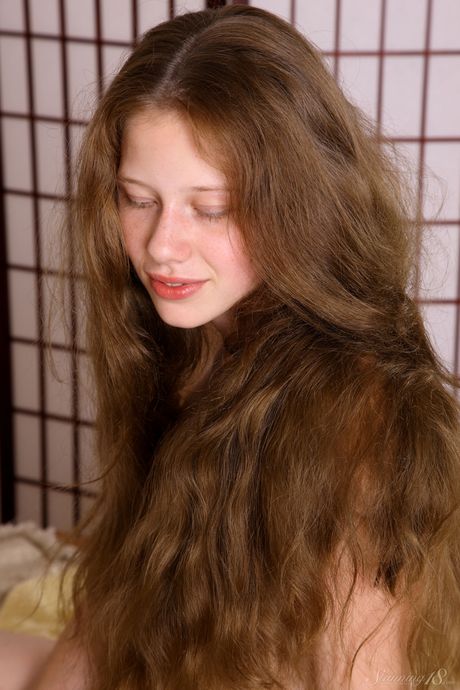 Innocent teen Nicole shows her tiny tits and bald pussy in the nude