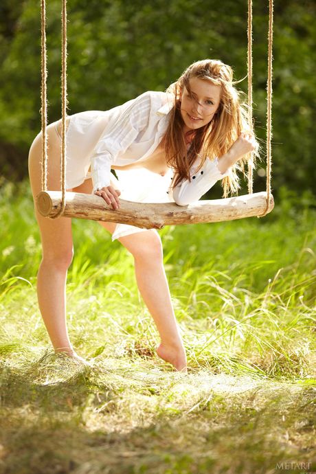 Solo girl Sasha J removes her panties to pose nude without embarrassment