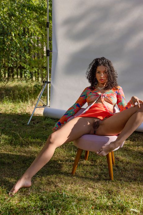 Skinny young Valery Ponce spreading naked in the garden to show her pussy