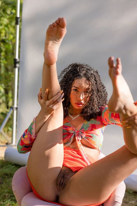 Skinny young Valery Ponce spreading naked in the garden to show her pussy