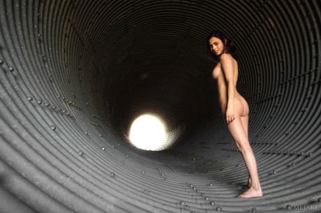 Hot teen Lara models totally naked on a backyard patio