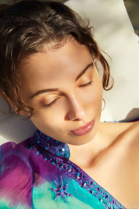 Sexy Latina teen Calypso strips to her high heels in a garden