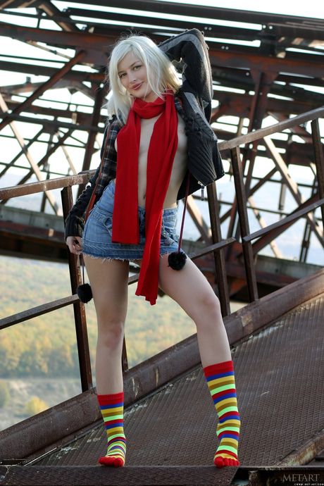 Ukrainian erotic model Lilu C exposes her hairy pussy and small tits outdoors