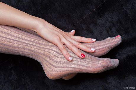 Naked girl Taini strikes great solo poses in white stockings