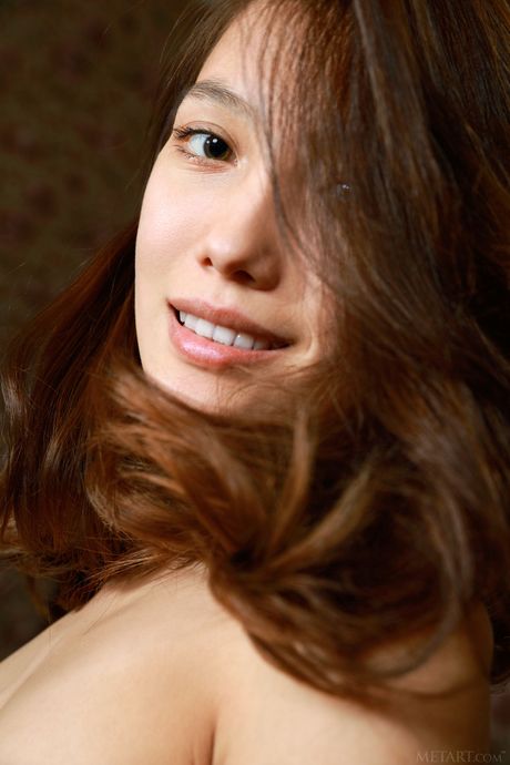 Thin teen Anna Aki removes her lingerie to pose nude in a public place