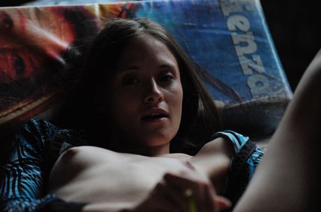 Intriguing teen Daniela shows her big tits and poses naked in a solo shoot