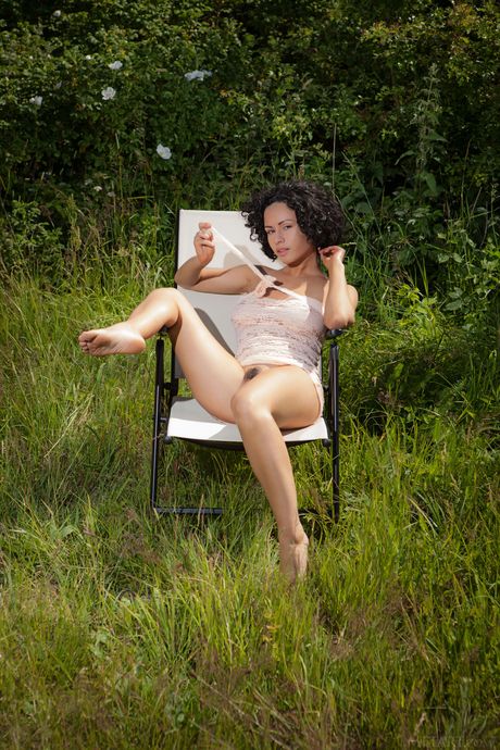 Brunette babe Pammie Lee flaunting her big tits and hairy pussy