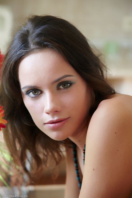 Lovely teen Cassia shows her beautiful body and poses nude in a solo