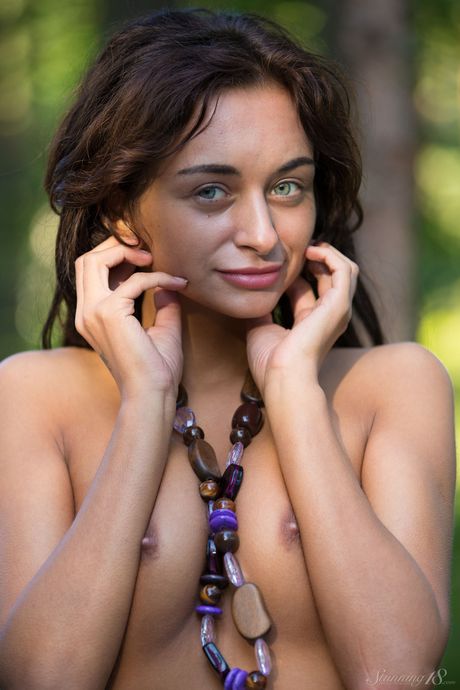 Nice teen Dolores M strikes confident nude poses on a picnic table