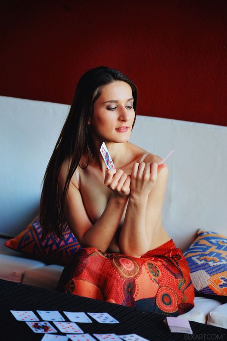 Pretty teen Elina slips a finger in her pussy after removing her lingerie