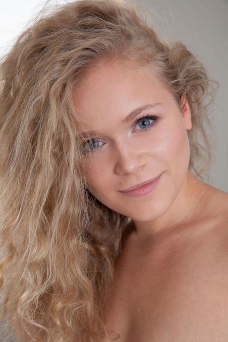 Sexy blonde Mikana removes her lingerie and shows her big tits and twat