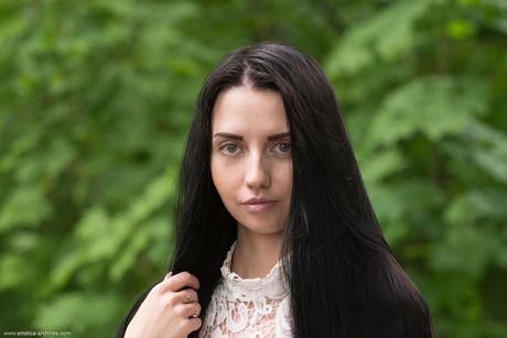 Veronica Snezna gets naked outside the forest lake and poses seductively