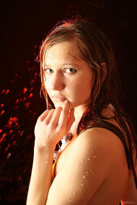 Skinny Russian lady Viola C gets wet while posing naked in a bathtub