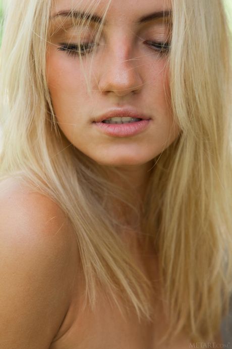 Blonde teen Jaime A gets naked on a patio while wearing a necklace