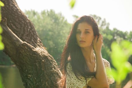 Ukrainian erotic model Katya Ac models totally naked in a shallow pool of water