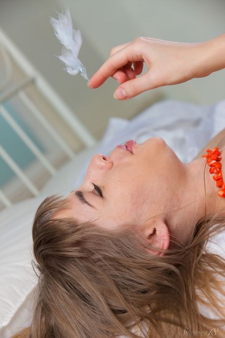 Adorable teen Lalovv A gets naked in a dressing room and shows her pussy