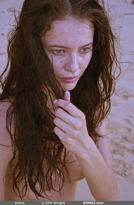 Skinny amateur teen babe with perky tits posing naked on the beach