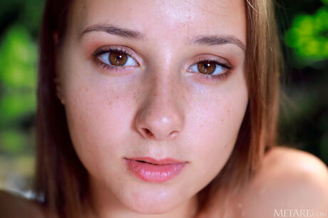 Rosalina is a vision of feminine allure, paddling in the river in a skimpy bikini