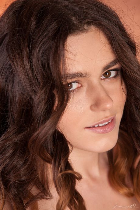 Mona doffs her black lingerie and poses nude in her heels