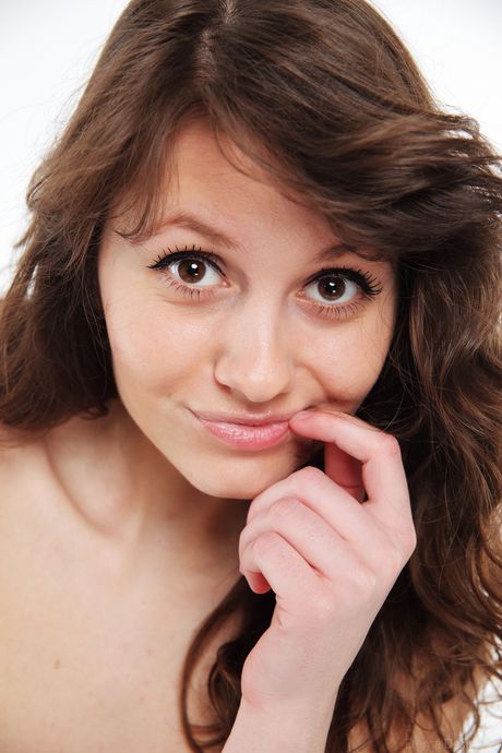 Tender teen Carmela A removes her underwear to get completely naked