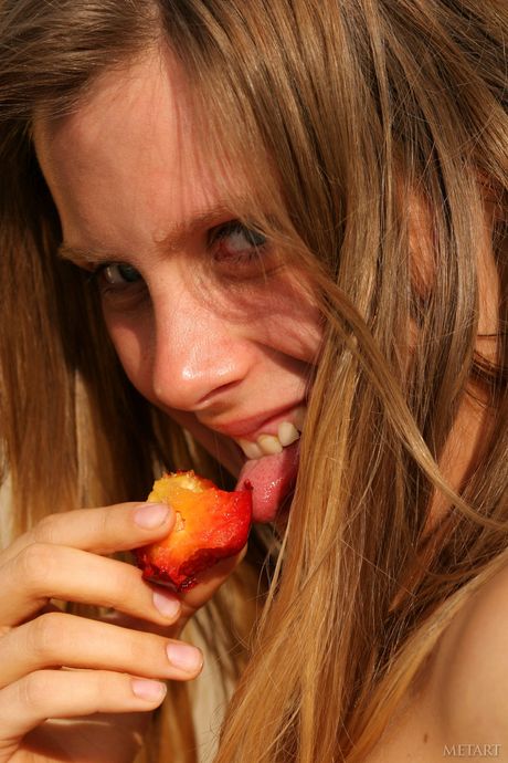 Russian belle Kate B models totally naked on a beach in the sand