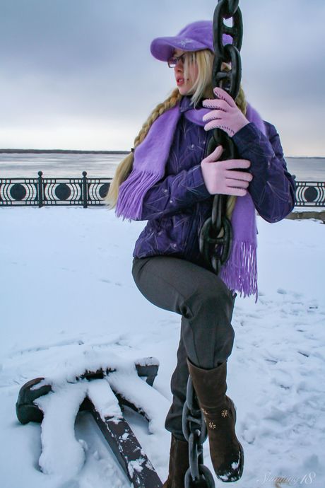 Barely legal girl Olya N gets naked in a snowbank while wearing glasses