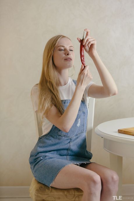 Alluring teen Maria Rubio strips naked in the kitchen and masturbates