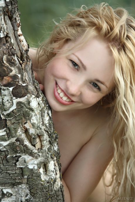 Slender teen Olya N strips naked in the garden & shows her hot body