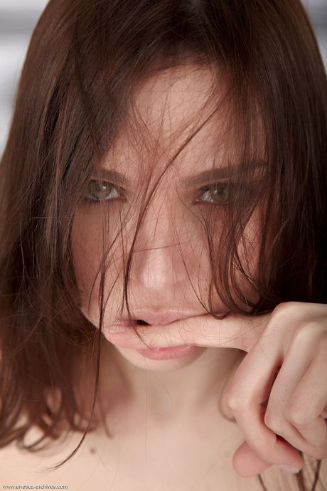 Brunette teen Oliviana poses completely naked on a bed without shyness