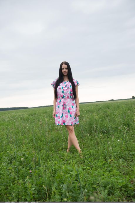 Russian peach Veronica Snezna gets totally naked in a field of wildflowers