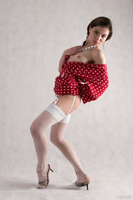 Lean teen Masha M exhibits her tiny tits and poses naked in high heels