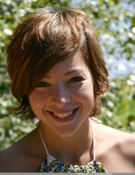 Skinny blonde Angelina shows her small tits and poses nude in a solo