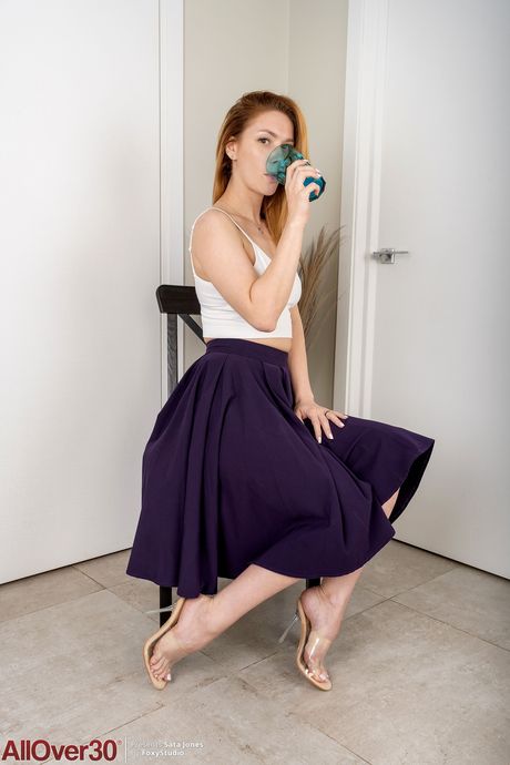 Sexy Russian MILF Sata Jones strips and shows her big booty and holes