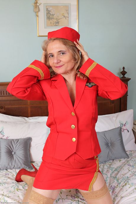 Mature secretary Isabella B strips & shows her big ass & hairy mature pussy