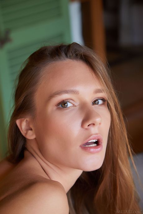 Hot teen Mirabella gets naked in high heels and shows her shaved pussy