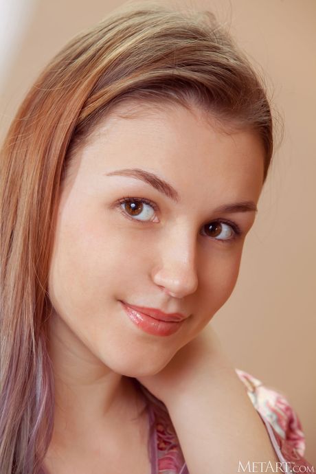 Stunning teen Isabele removes her robe and panties to pose nude in the kitchen