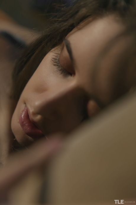 Delightful teen Emily J sucks on a lollipop before fingering her hairy pussy