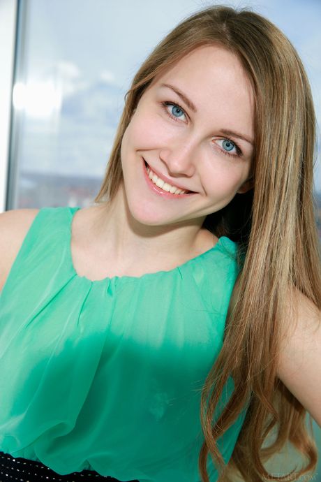 Skinny Russian lovely Violet strips and reveals her naked form in the window