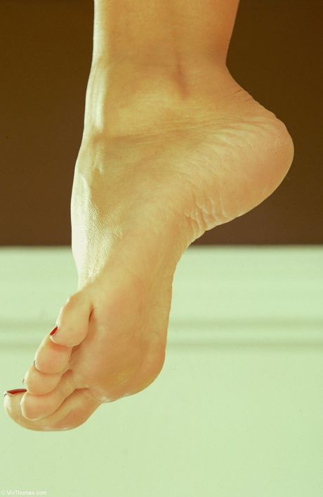 Skinny blonde Silvia Saint shows her big tits and poses naked in a solo