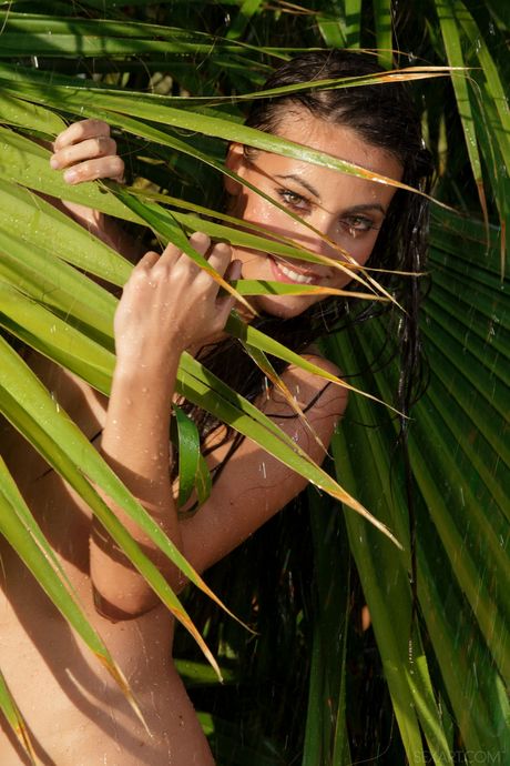 Petite teen Lorena B shows her tiny tits and shaved pussy outdoors