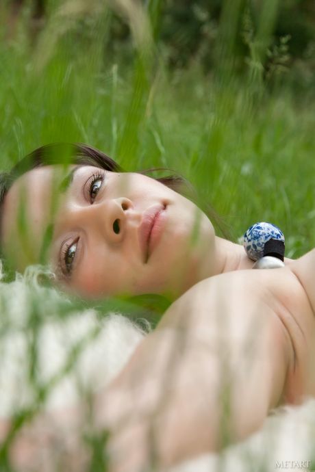 Intriguing teen Katy C presents her big tits and poses naked