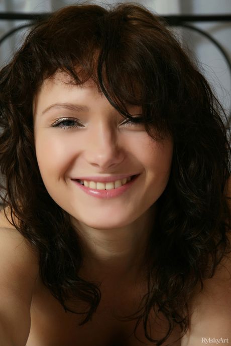 Russian venus Ally shows off her big tits and ass while naked on her bed