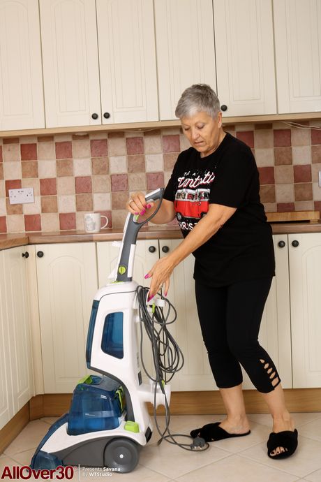 Mature granny Savana shows off her big saggy tits & her hairy muff