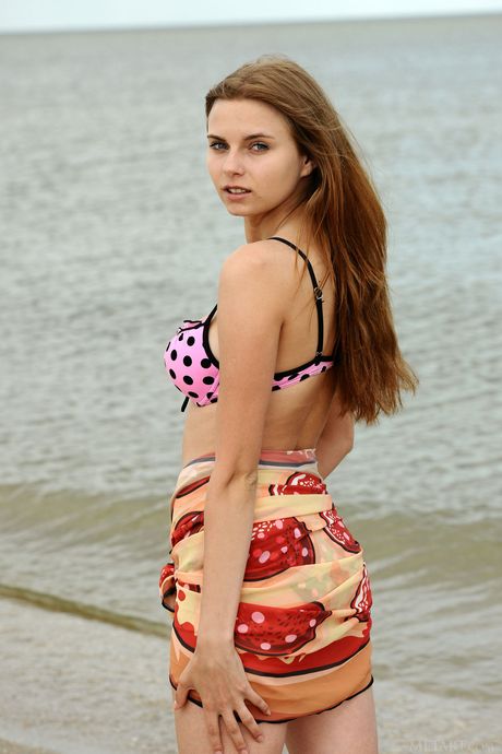 Beautiful teen Yuki strips off her bikini and flaunts her big tits & bald pussy