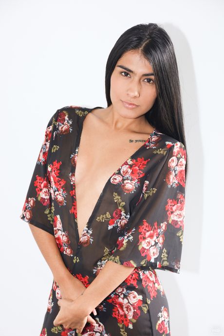 Cute teen Valery shows her tiny tits and presents her bald pussy in a solo