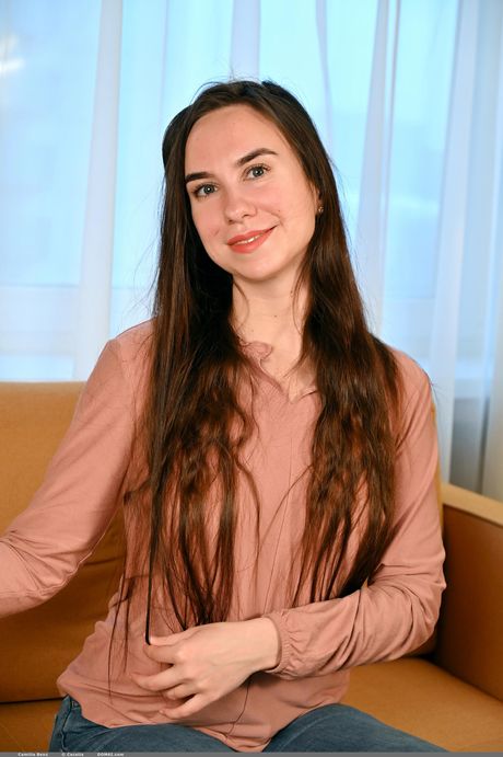 Brunette teen Camilla Benz strips off on a sofa confidently