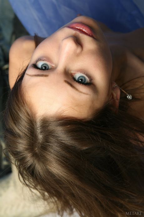 Russian erotic model Nadya B shows her big tits and hairy pussy