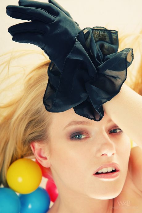 Petite teen Mia shows her small natural tits and poses in stockings