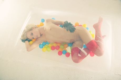 Petite teen Mia shows her small natural tits and poses in stockings